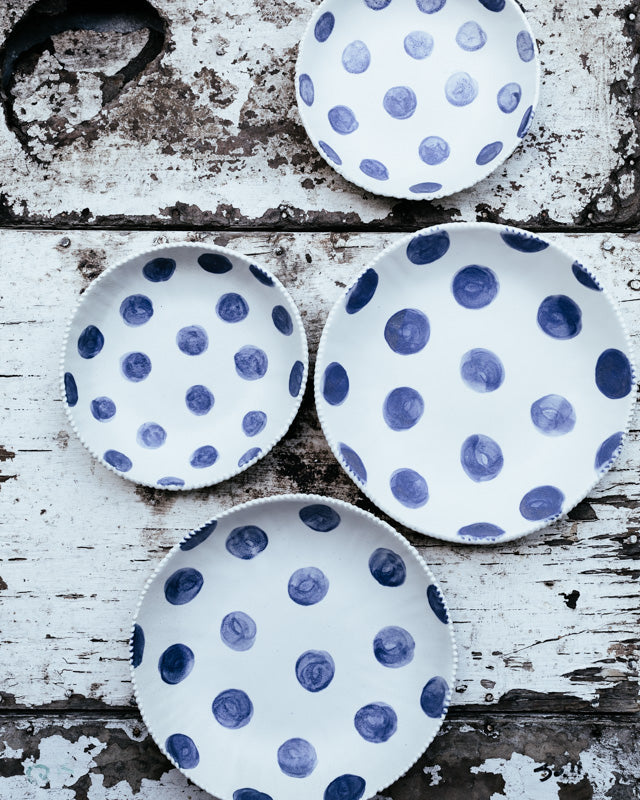 blue and white spot bowls with textured rims handmade by clay beehive ceramics.