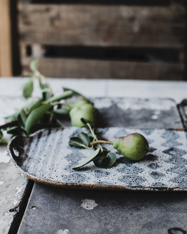 hand made ceramic rustic gritty platter  glazed in satin black and white by clay beehive 