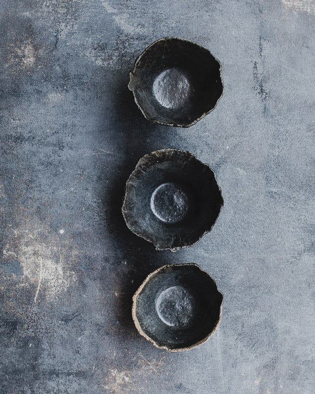 Black rustic bowls with a wabi sabi look hand made by clay beehive ceramics
