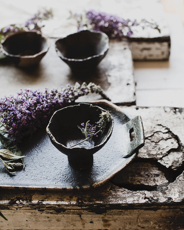 Black rustic bowls with a wabi sabi look hand made by clay beehive ceramics