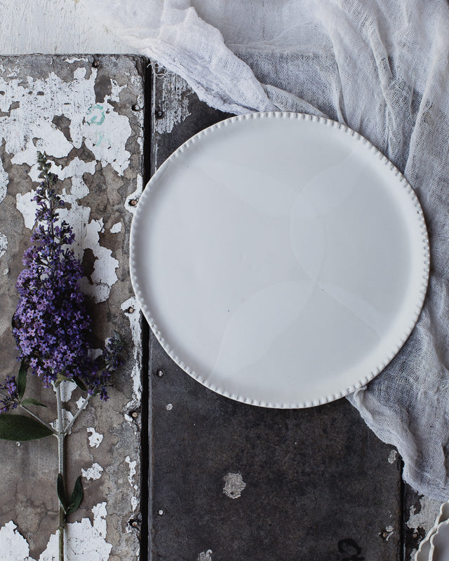 satin white plate handmade with detailed texured rim from clay beehive ceramics