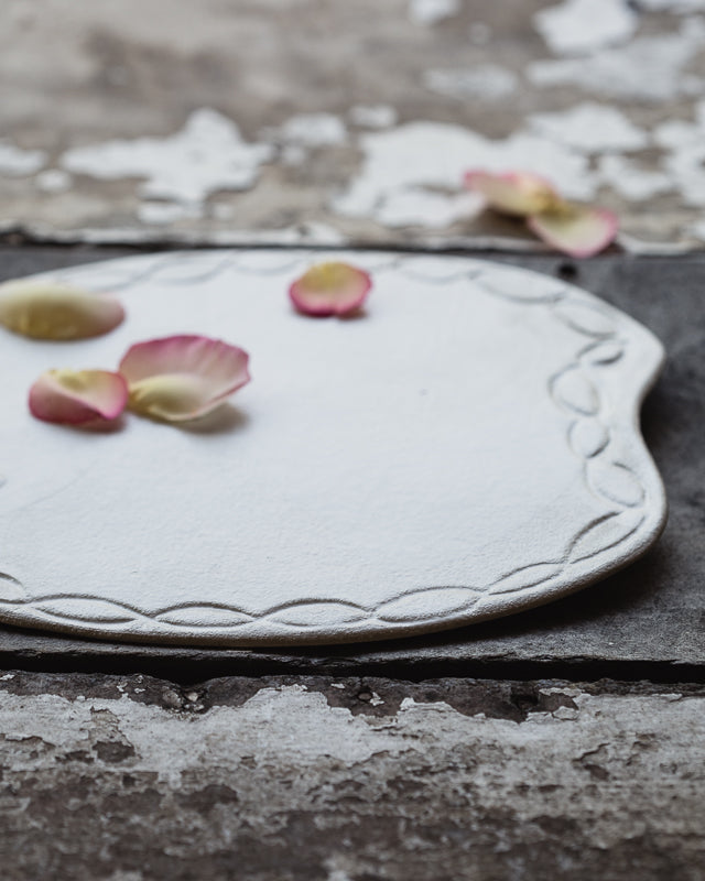 satin white platter plate hand made with a carved rim by clay beehive ceramics