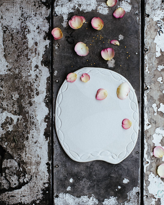 satin white platter plate hand made with a carved rim by clay beehive ceramics