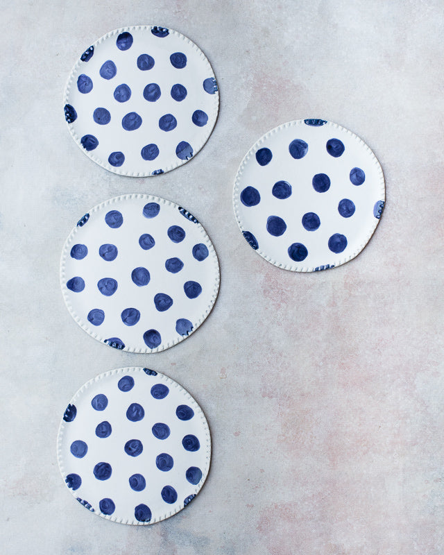 hand made blue polka dot plates with detailed rim cake size by clay beehive ceramics