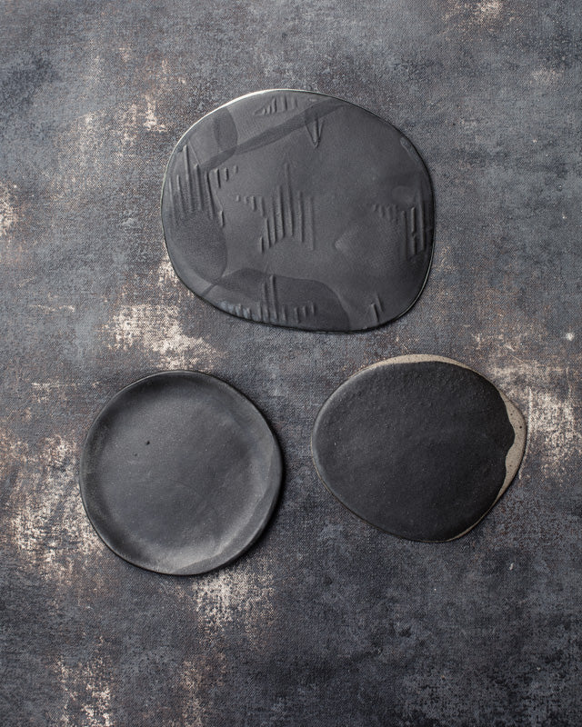 black small ceramic plates by clay beehive ceramics