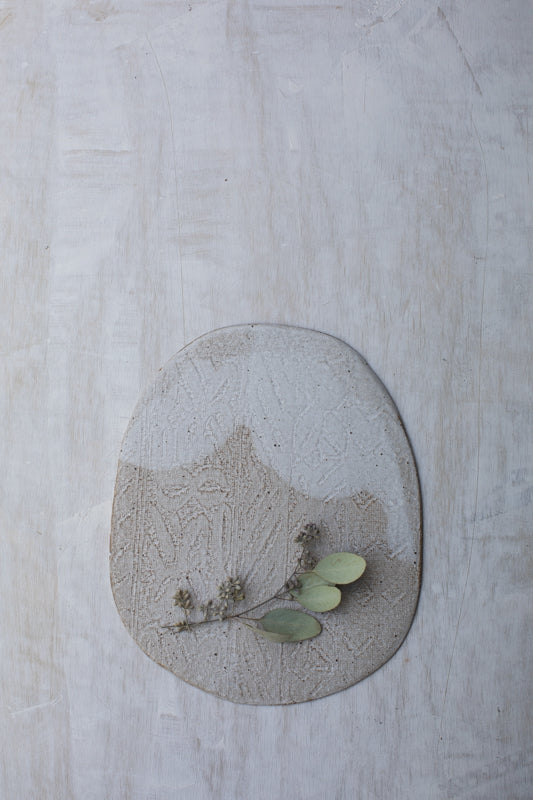 Textured cheese board handmade with stoneware clay by clay beehive ceramics