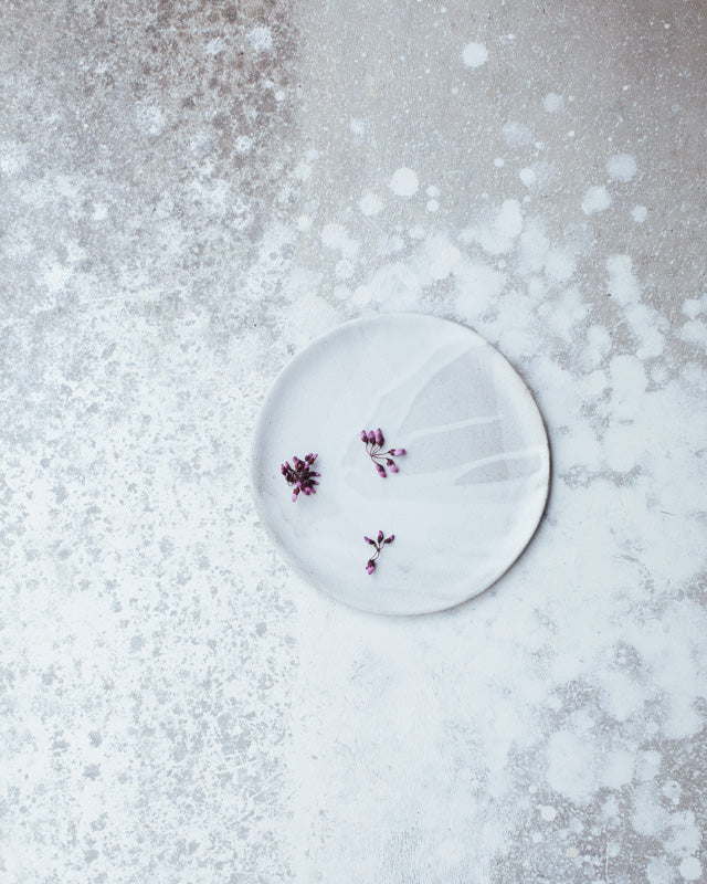 Satin white glazed plate with drippy effect hand crafted by clay beehive ceramics