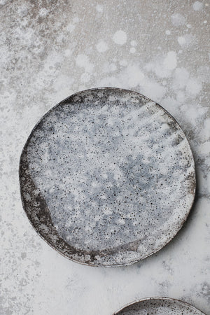 Gritty shallow bowls / plates with organic shapes and glaze patterns