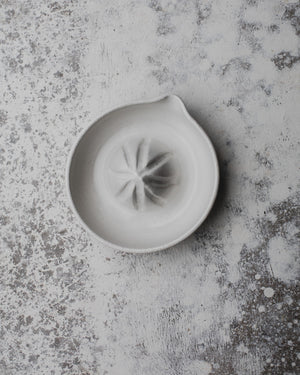 ceramic wheelthrown juicer in satin white holds one cup of juice made by clay beehive ceramics