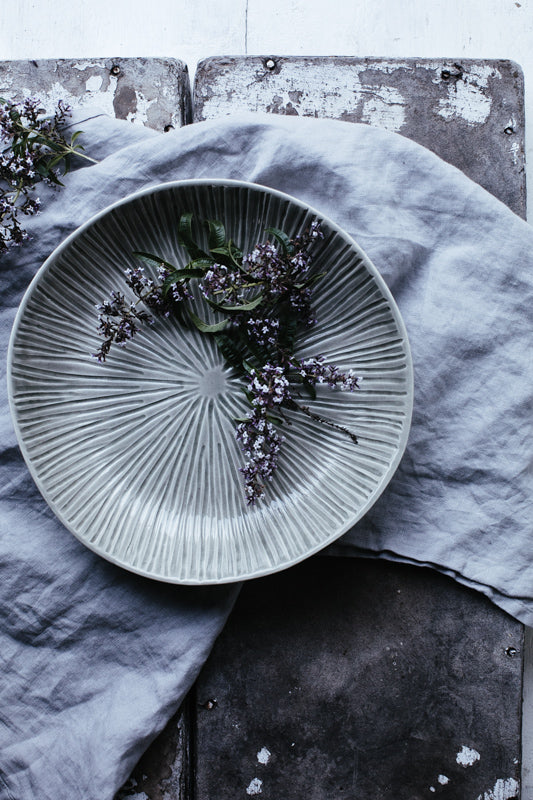 celadon glazed carved bowl by clay beehive