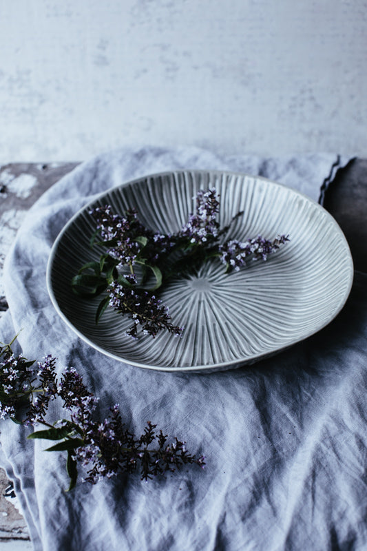 celadon glazed carved bowl by clay beehive