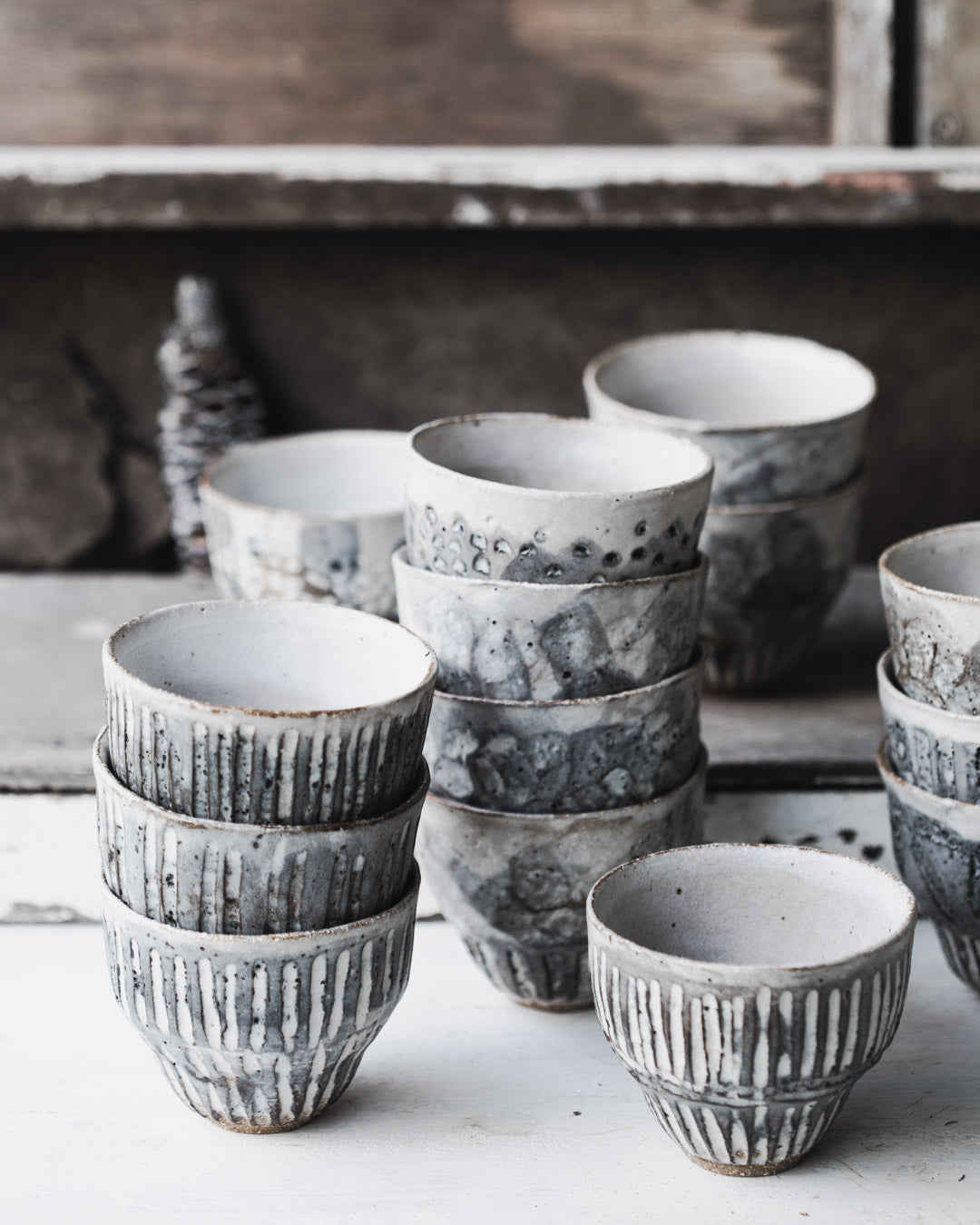 Carved rustic handmade yunomi style cups with grey/white glazing by clay beehive ceramics