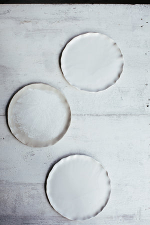 Satin white cake plates with an elegant rim