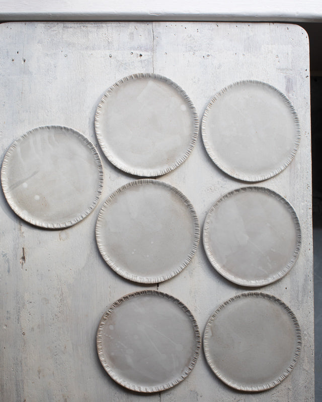 Satin white Plates with drippy glaze and carved rims