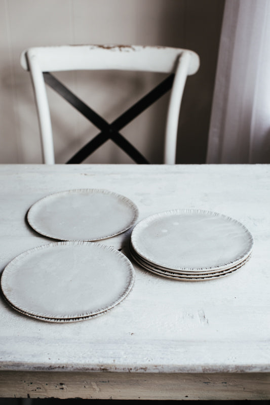 Satin white Plates with drippy glaze and carved rims