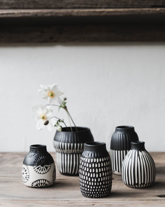 Black and white carved bud vases