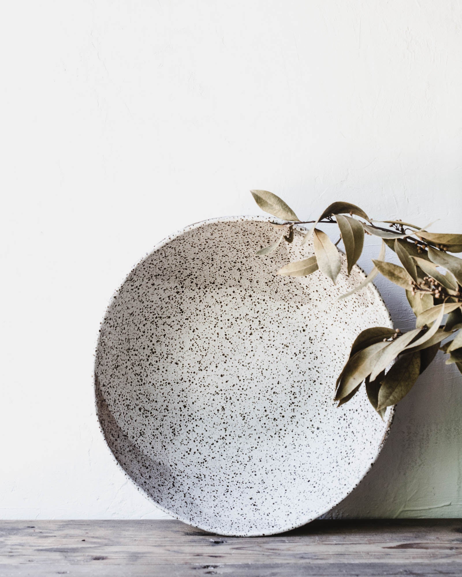 Extra large speckled rustic white bowl with a pinched texture handmade by clay beehive ceramic