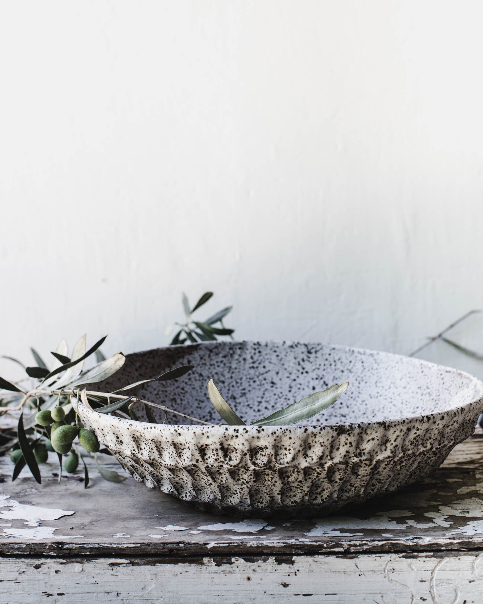 Extra large speckled rustic white bowl with a pinched texture handmade by clay beehive ceramic