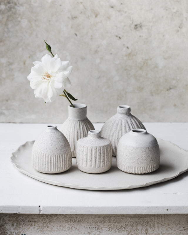 Carved speckled white bud vases