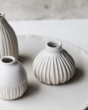 Satin white wheel thrown bud vases with carving details by clay beehive ceramics