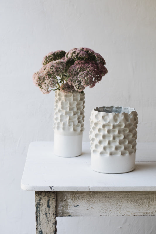 Large white sculptural pinched textured vases