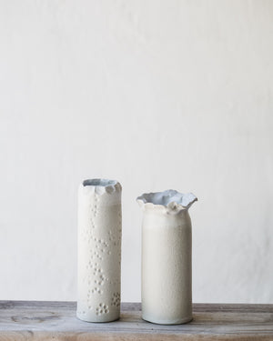 White tall slender vases with exposed raw clay exterior (Group Two)