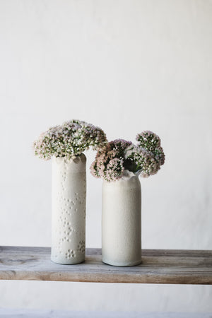 White tall slender vases with exposed raw clay exterior (Group Two)