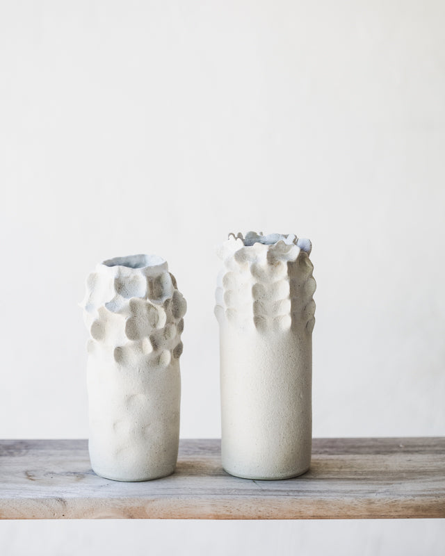 White tall slender vases with exposed raw clay exterior (Group Three)