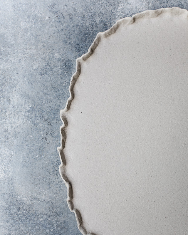 frilly rim natural raw clay oval shaped platter hand made by clay beehive ceramics