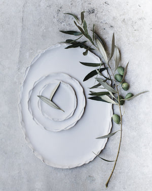 Pretty oval shaped white handmade platter with delicate pretty edging by clay beehive ceramics