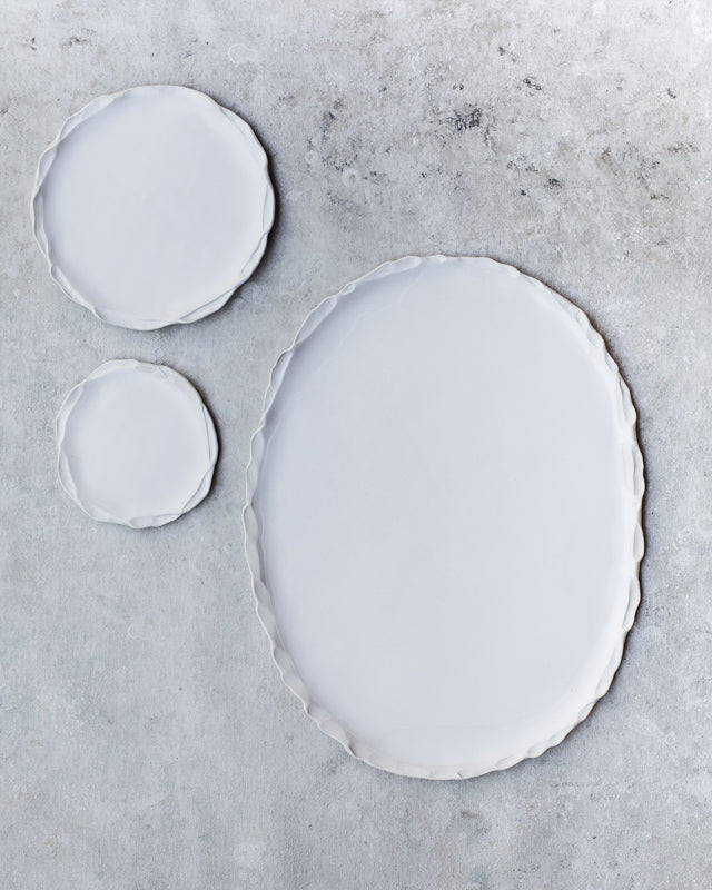 Pretty oval shaped white handmade platter with delicate pretty edging by clay beehive ceramics